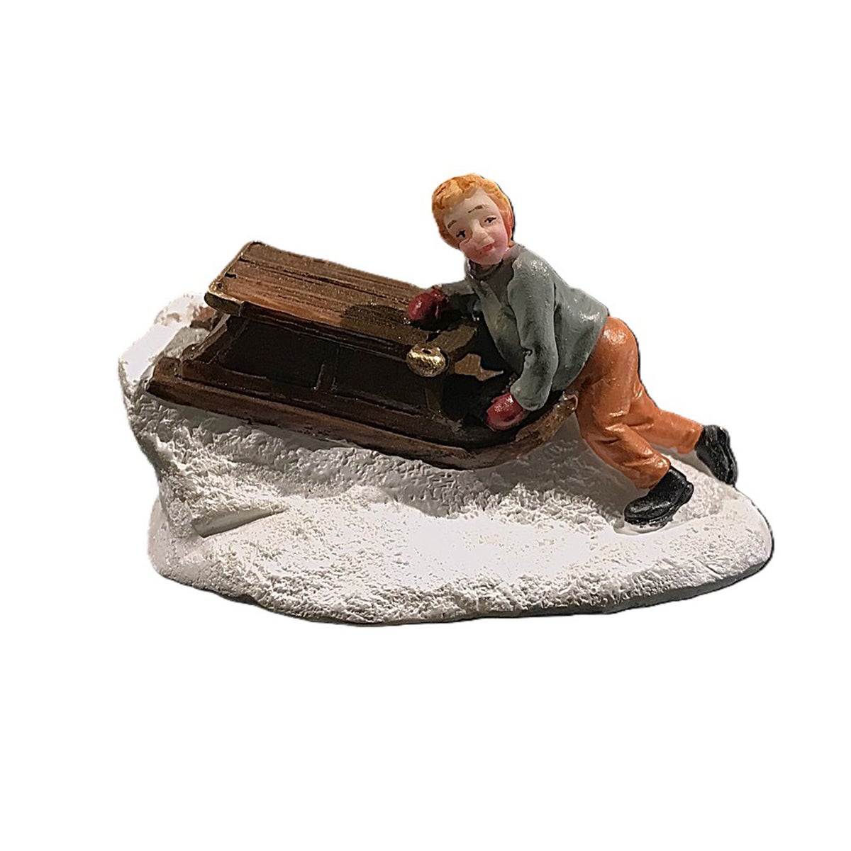 Kerstdorp jongen met slee Kerstdorp jongen met slee